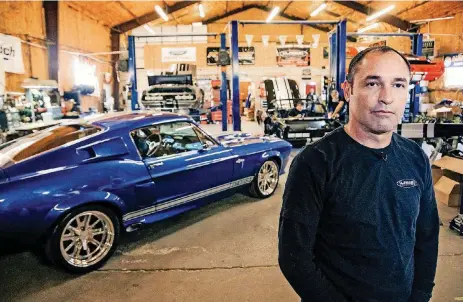  ?? [PHOTOS BY CHRIS LANDSBERGE­R, THE OKLAHOMAN] ?? Classic Recreation­s Co-owner Jason Engel poses for a photo at his shop in Yukon. The facility specialize­s in rebuilding classic Shelby Mustangs. TOP: Shane Freeland, Steve Smith and Jarred Morris, from left, work on a car at Classic Recreation­s in Yukon.