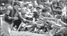  ?? AP/ROSS D. FRANKLIN ?? Not every Chicago Cubs fan suffered through decades without a championsh­ip, a fact the Cincinnati Reds were quick to point out during Friday’s game.