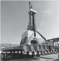  ?? LEONHARD FOEGER/REUTERS ?? A drilling rig of Austria’s oil and gas group OMV is seen at their explorator­y drilling site near Maustrenk, Austria, last year.