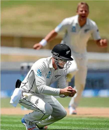  ?? PHOTO: PHOTOSPORT ?? Henry Nicholls grabs a close-in catch to dismiss West Indies batsman Shane Dowrich, much to the delight of Black Caps bowler Neil Wagner.