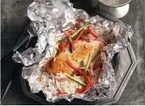  ?? | FAMILY FEATURES ?? Dish it up:
(From left) Wrap chicken, instant rice and few other ingredient­s in aluminum foil, place on the grill and — presto! — dinner is ready in less than 30 minutes. Dried cranberrie­s and apricots add bursts of flavor to this Fruity Couscous....