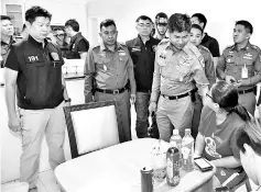  ??  ?? Thai Tourist Police Bureau (TPB) acting deputy chief Maj Gen Surachet Hakpan (centre) meeting the victim. - Bernama photo