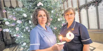  ??  ?? ●●St Ann’s nurses Sarah Thorley and Fiona Troup at last year’s service in Manchester Cathedral