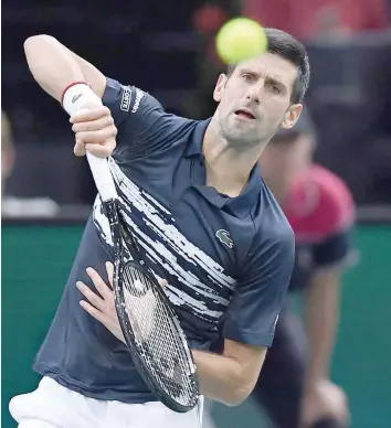  ?? — AFP ?? Serbia’s Novak Djokovic makes a return to France’s Corentin Moutet during the ATP World Tour Masters 1000 - Rolex Paris Masters - indoor tournament at the Accorhotel­s Arena in Paris.