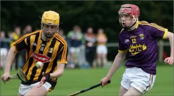  ??  ?? Wexford’s Micheál O’Connor pursues Kilkenny midfielder Aaron Brennan.