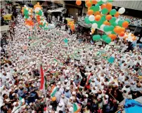  ?? PTI ?? People from the Muslim community release tricolour balloons during 71st Independen­ce Day celebratio­ns in Ahmedabad. —