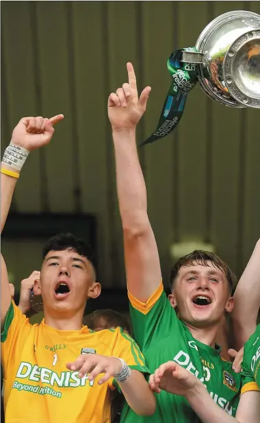  ??  ?? Meath captain Matthew Costello lifts The Murray Cup after the Electric Ireland Leinster GAA Football Minor Championsh­ip Final.