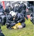  ??  ?? Am Landtag wurden einige Demonstran­ten am Boden fixiert.