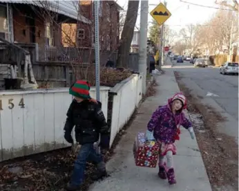  ?? EDWARD KEENAN ?? Colum and Irene Keenan, children of Edward Keenan, delivering boxes for the Toronto Star Santa Claus Fund.