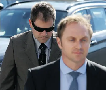  ?? CHAD HIPOLITO / THE CANADIAN PRESS ?? Kenneth Fenton, left, arrives for his sentencing hearing in Colwood, B.C., on Friday. He was convicted in the impaired driving death of RCMP Const. Sarah Beckett last year.