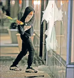  ??  ?? Smashing display: Democratic pols deserve blame for fueling violence. Here, a rioter attacks an Adidas store on Houston Street in Manhattan.