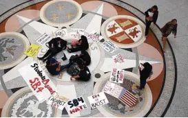  ?? Eric Gay / Associated Press ?? Students gather in the Rotunda at the Texas Capitol to oppose SB 4, an anti”sanctuary cities” bill that has already cleared the Texas Senate.