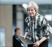  ?? MATT CARDY/GETTY ?? Prime Minister Theresa May arrives to deliver a speech as she opens the Farnboroug­h Airshow on Monday.