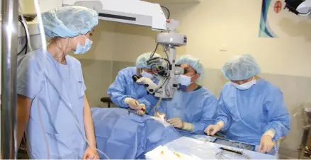  ?? Photo: Ronald Kumar ?? Watching through a microscope, Dr Choi Gyung Bai with the JC Bit Somang Eye and Internal Medicine Clinic team from Korea providing free eye surgery at the Pacific Eye Institute in Suva on August 29, 2017.