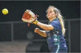  ?? Staff photos by Michael Minasi ?? College Park’s Grace Sample (11) catches the ball for an out during the softball game against Montgomery on March 9 at Montgomery High School.