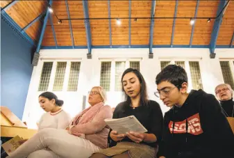  ?? Niels Wenstedt / AFP / Getty Images ?? Seyran (right) and his sister Warduhi were born in Armenia. The family has taken shelter in the Bethel church in The Hague, which is holding non-stop services to prevent deportatio­n.