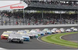  ?? (AP/Darron Cummings) ?? Kevin Harvick leads the field through the first turn of the NASCAR Cup Series Brickyard 400 in September at Indianapol­is Motor Speedway. NASCAR’s Cup Series will share a venue with IndyCar on the same weekend for the first time in history.