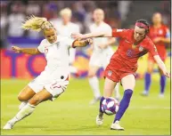  ?? Richard Heathcote / TNS ?? Rachel Daly of England battles for possession with Rose Lavelle of the United States during the Women’s World Cup semifinals at Stade de Lyon on Tuesday in Lyon, France.