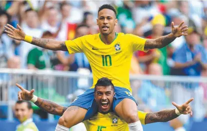  ?? Picture: GETTY IMAGES ?? MAN OF MOMENT: Neymar of Brazil celebrates with teammate Paulinho after scoring against Mexico.