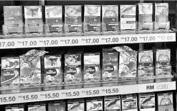  ??  ?? The price of cigarettes from all brands have been increasing since October this year. - Bernama photo