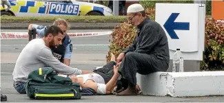  ?? STACY SQUIRES/STUFF ?? A victim of the shooting at Linwood Ave mosque in Christchur­ch is tended to.