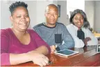  ?? Picture: FREDLIN ADRIAAN ?? READY TO ROLL: Frederick and Son Food Truck staff Gracious Kufandiror­i, left, Siyabonga Adam and Olwethu Mvula wait for patrons at the 2 For 1 Tuesday market in Baakens Valley