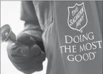  ?? COLLEEN MCGRATH/THE HERALD-MAIL ?? The sight of a Salvation Army red kettle and bell ringer may be common at this time of year, but fundraisin­g never takes a day off.