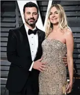  ?? EVAN AGOSTINI/INVISION ?? Jimmy Kimmel, shown with his wife, Molly McNearney, says their son was born April 21 with a heart defect.
