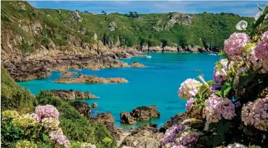  ??  ?? Secluded: Moulin Huet Bay on Guernsey, one of five Channel Islands in a new walking trail