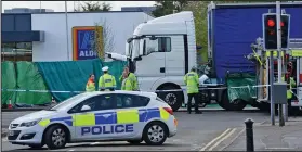  ??  ?? Aftermath: The crashed HGV outside the Aldi store in Reading