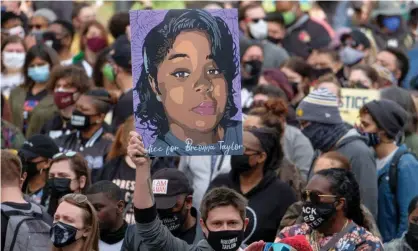  ??  ?? A rally in remembranc­e of Breonna Taylor in Louisville, Kentucky on 13 March 2021. Photograph: Jeff Dean/AFP/Getty Images