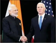  ?? REUTERS ?? PM Modi shakes hands with US Vice President Mike Pence during their bilateral meeting, in Singapore, on Wednesday.