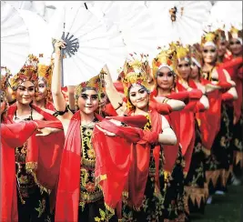  ??  ?? UNITY: Dancers perform on Independen­ce Day at the presidenti­al palace in Jakarta, yesterday. Indonesia gained independen­ce from the Netherland­s in 1945. Picture: EPA