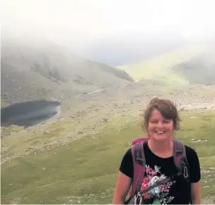  ??  ?? Foster mum Joy Burke climbed Snowdon with her two foster children to help raise money for The Adolescent and Children’s Trust (TACT) Cymru charity