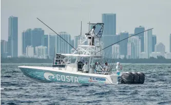  ??  ?? Capt. Quinton Dieterle, with his Contender
One team (below), is just one of many who rely heavily on Miami’s healthy baitfish stocks.