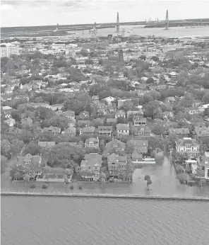  ?? COAST GUARD VIA GETTY IMAGES ?? In Charleston, S. C., some homes would need to pay average premiums of $ 18,211 to cover anticipate­d costs of flooding, data shows.