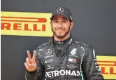  ??  ?? Mercedes’ Lewis Hamilton of Britain celebrates winning the F1 Styrian Grand Prix at the Red Bull Ring in Spielberg, Austria, yesterday. — Reuters