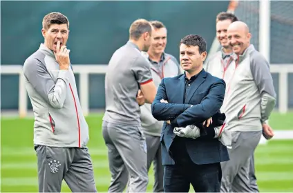  ??  ?? Winning team: Ross Wilson (centre) and Steven Gerrard (left) have brought success back to Ibrox, with the help of Alfredo Morelos (below)