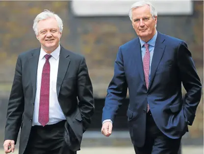  ?? /Reuters ?? Key talks: Britain’s Brexit minister, David Davis, left, welcomes EU chief Brexit negotiator Michel Barnier to Downing Street in London on Monday for talks this week on Britain’s exit from the EU.