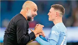  ?? ?? Pep Guardiola with Phil Foden