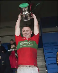  ??  ?? Leighton Glynn lifts the Miley Cup in Joule Park Aughrim.