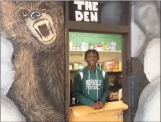  ?? Dave Stewart / Hearst Connecticu­t Media ?? Norwalk's Jeremiah Simeon at the Norwalk High School Food Pantry in "The Den" area of the school's lobby. Simeon, a senior, helped establish the food pantry as part of his work with SAVE, Inc.