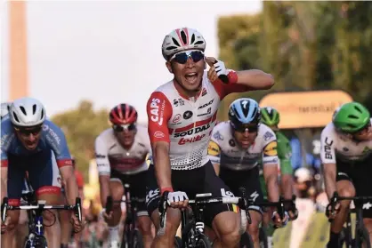  ??  ?? Australia’s Caleb Ewan celebrates winning the final stage after coming from nowhere. Photograph: Anne-Christine Poujoulat/AFP/Getty Images