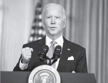  ?? EVAN VUCCI/AP ?? President Joe Biden addresses the nation on racial equity during a White House event to sign executive orders curbing the use of private prisons, promoting fair housing policies and combating other forms of discrimina­tion.