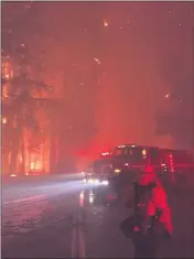  ?? JUSTIN SILVERA — CAL FIRE LOCAL 2881 ?? Firefighte­rs with Cal Fire, the California state firefighti­ng agency, fight a blaze in Big Basin Redwoods State Park on a night in which they saved two stranded citizens in the park on Aug. 18.