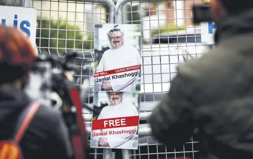  ??  ?? Posters protesting Jamal Khashoggi’s disappeara­nce seen on the police barricades around the Saudi Consulate in Istanbul during demonstrat­ions, Oct.14.