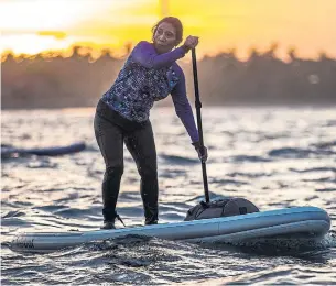  ?? KEMAL JUFRI PHOTOS/THE NEW YORK TIMES ?? Susi Pudjiastut­i, a paddleboar­der and Indonesia’s maritime affairs and fisheries minister, has made a name for herself by seizing illegal fishing boats and blowing them up.