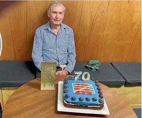  ?? ?? In April 2021, the Wellington Harrier Athletic Club presented Barry Everitt with a cake in recognitio­n of his 70-year involvemen­t with the club.