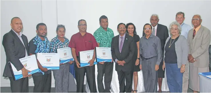  ?? Photo: Fijian Elections Office ?? Representa­tives from the five registered political parties with their listings handed over to them by the Electoral Commission chairperso­n Suresh Chandra (sixth from left) in Suva on June 12, 2017.