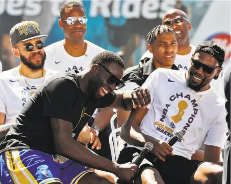  ?? Carlos Avila Gonzalez / The Chronicle ?? Draymond Green and Kevin Durant are all fun and laughter during a rally to get the victory parade party started.